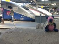 Sam with train in background