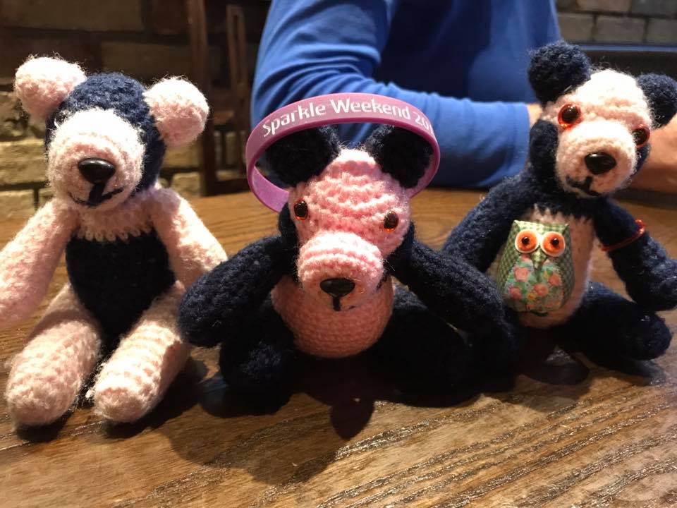 Three pandas plus wristband