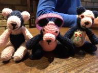 Three pandas plus wristband