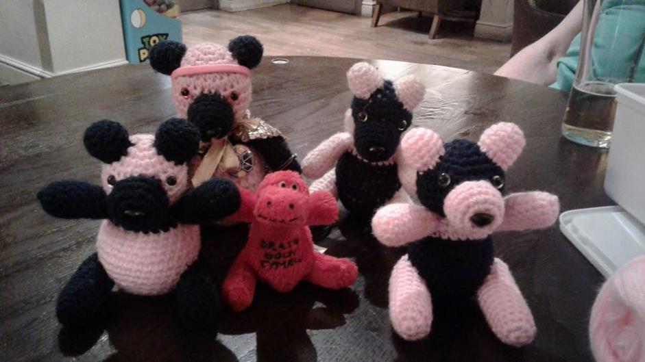 Four pandas and a red dragon