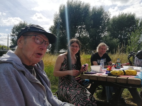 People sitting at a picnic table
